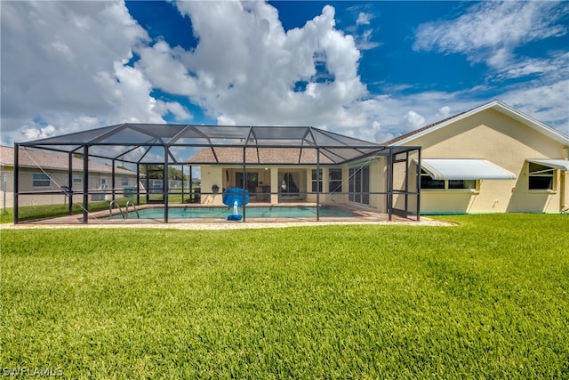 back of house with a lawn and glass enclosure