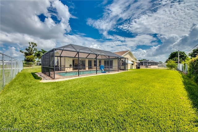 view of yard with a fenced in pool and a lanai