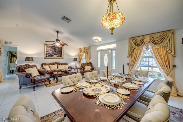 tiled dining room featuring ceiling fan and lofted ceiling