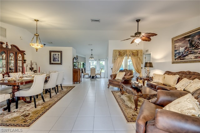 tiled living room with ceiling fan