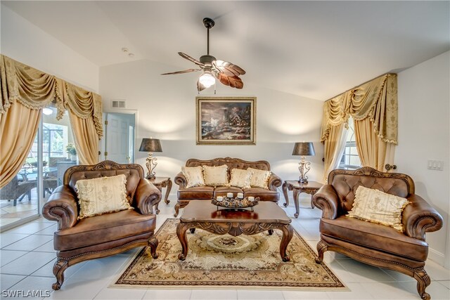 tiled living room featuring vaulted ceiling and ceiling fan