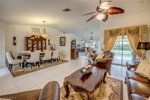 living room with light tile patterned flooring, lofted ceiling, and ceiling fan