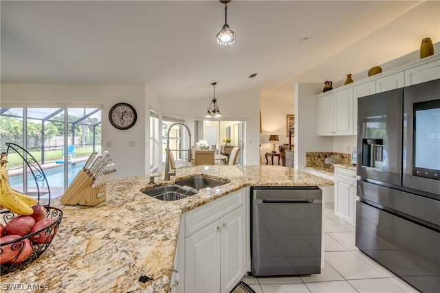 kitchen featuring white cabinets, sink, light tile patterned floors, stainless steel dishwasher, and refrigerator with ice dispenser