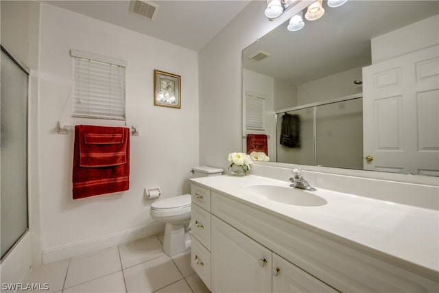 full bathroom featuring tile patterned floors, vanity, combined bath / shower with glass door, and toilet