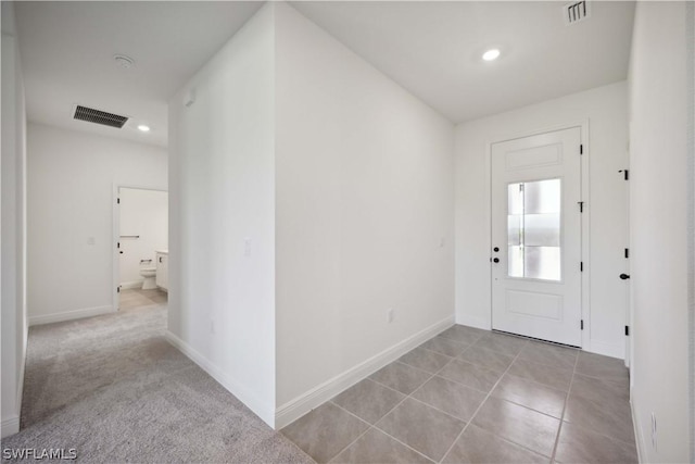 foyer with light tile patterned flooring