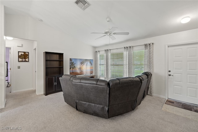 living room with light carpet, ceiling fan, and high vaulted ceiling