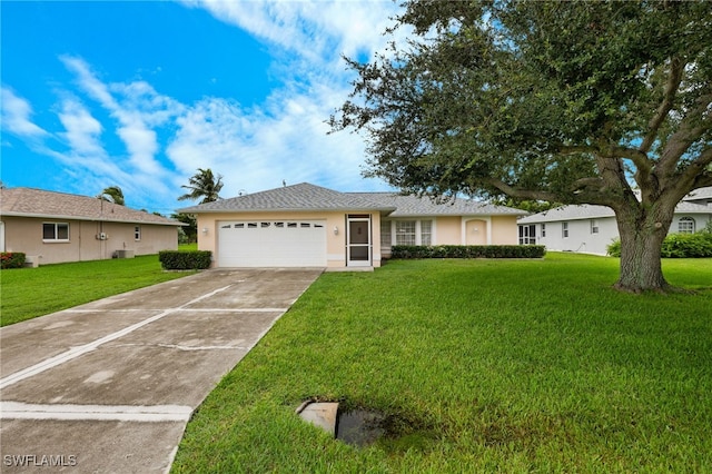 ranch-style house with a garage and a front lawn