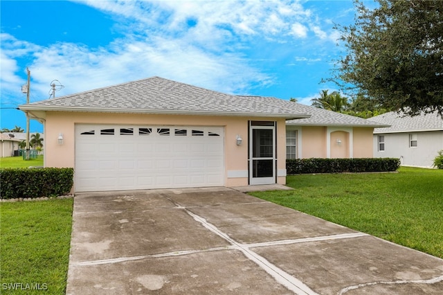 ranch-style house with a garage and a front lawn