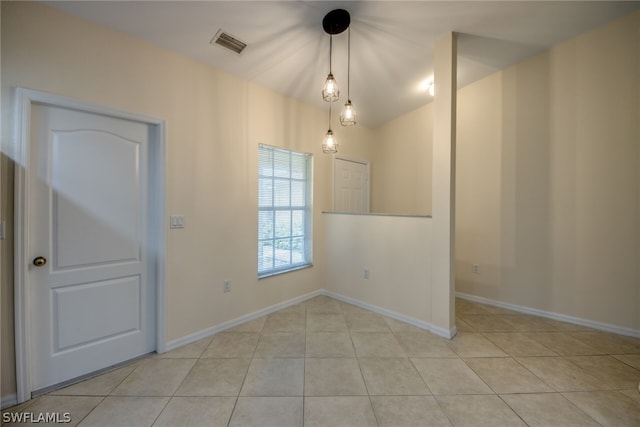 empty room with light tile patterned floors