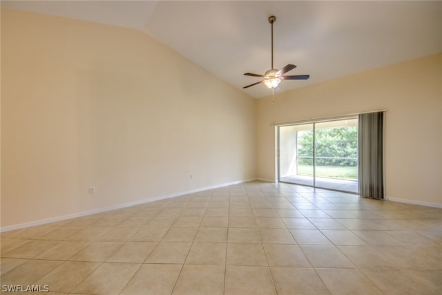 spare room featuring vaulted ceiling, ceiling fan, and light tile patterned flooring