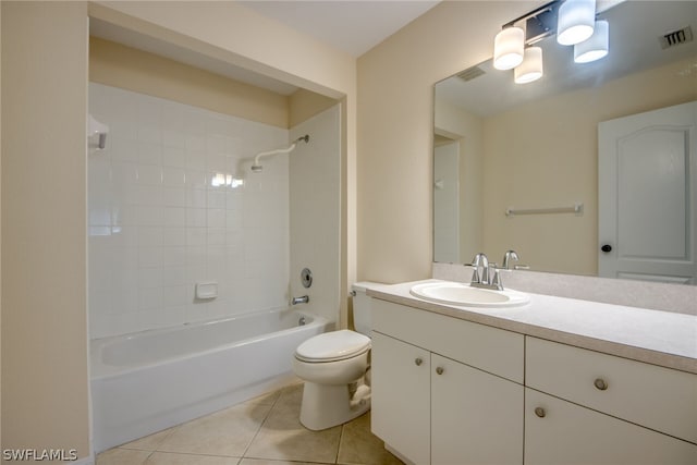 full bathroom featuring toilet, tile patterned flooring, tiled shower / bath, and vanity