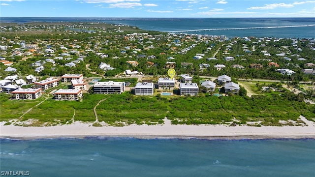 birds eye view of property featuring a view of the beach and a water view