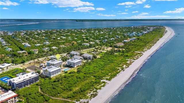 drone / aerial view featuring a view of the beach and a water view