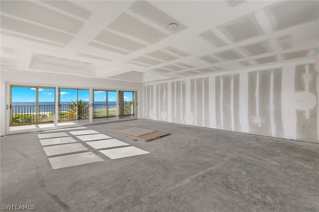 spare room featuring a water view