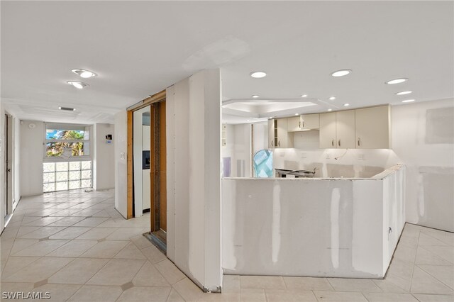 kitchen featuring light tile patterned flooring