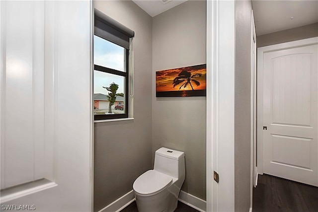 bathroom featuring toilet and hardwood / wood-style flooring