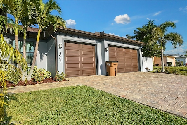 garage with a yard