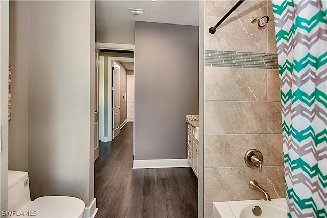 full bathroom with vanity, toilet, hardwood / wood-style flooring, and shower / bathtub combination with curtain