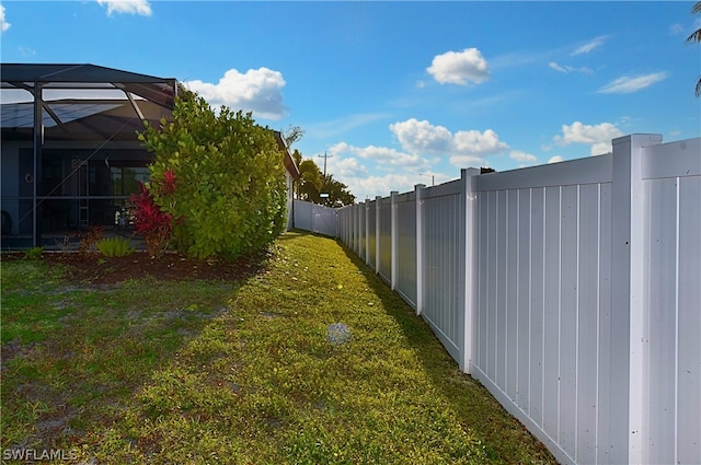 view of yard featuring a lanai