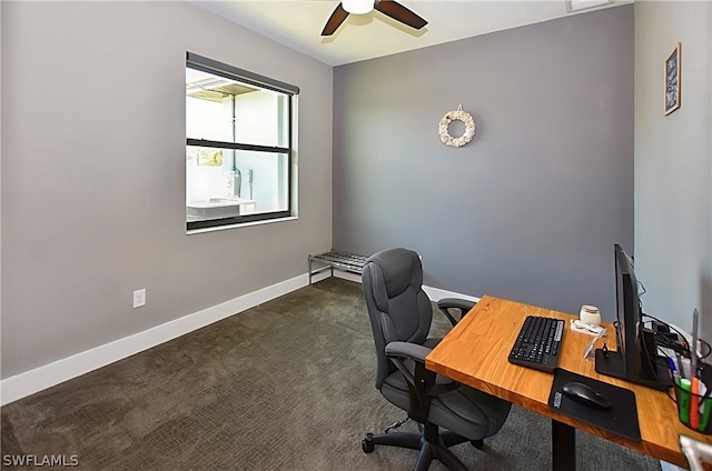 carpeted office featuring ceiling fan