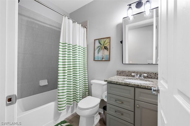 full bathroom featuring shower / tub combo, vanity, and toilet