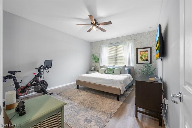 bedroom with hardwood / wood-style flooring and ceiling fan