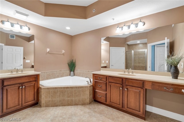 bathroom featuring independent shower and bath, tile patterned flooring, and vanity