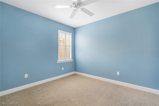 carpeted empty room with ceiling fan