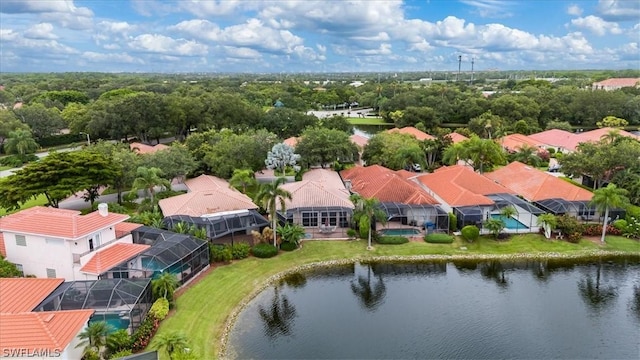 drone / aerial view with a residential view and a water view