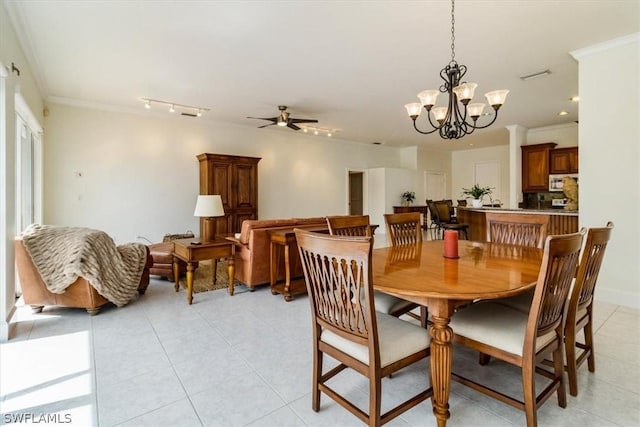 dining area with ceiling fan with notable chandelier, visible vents, crown molding, and light tile patterned flooring