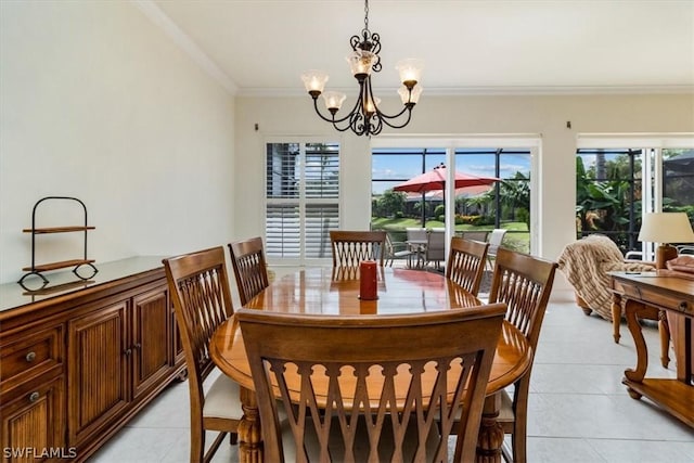 dining room featuring ornamental molding, light tile patterned flooring, and a notable chandelier