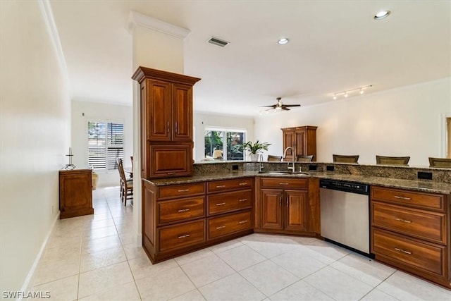 kitchen featuring visible vents, dishwasher, a sink, and light tile patterned floors