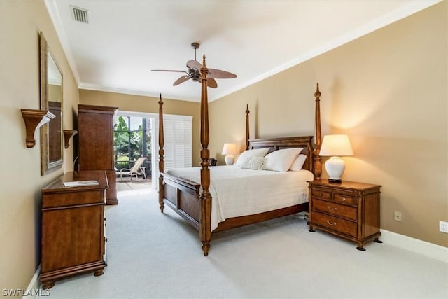 bedroom with light colored carpet, crown molding, visible vents, and baseboards