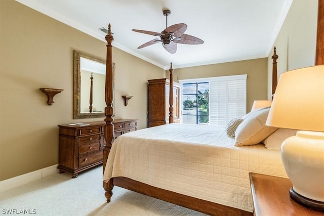 bedroom featuring baseboards, visible vents, crown molding, and light colored carpet