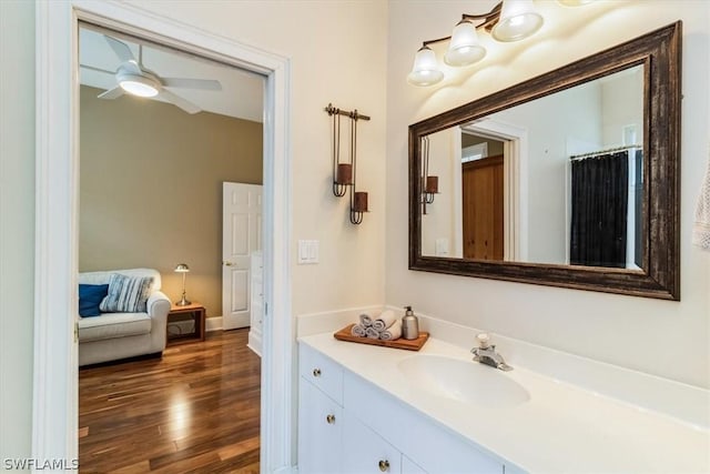 full bath with ceiling fan, wood finished floors, and vanity