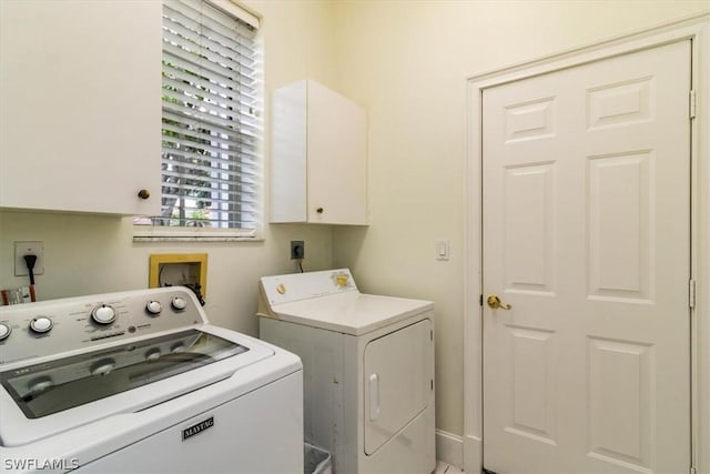 laundry area with cabinet space and washer and clothes dryer