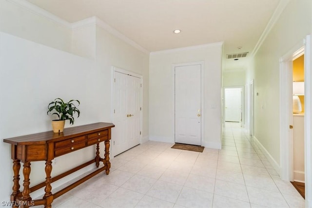 corridor featuring baseboards, visible vents, and crown molding