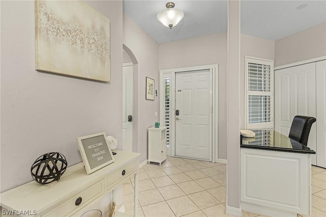 foyer with light tile patterned floors