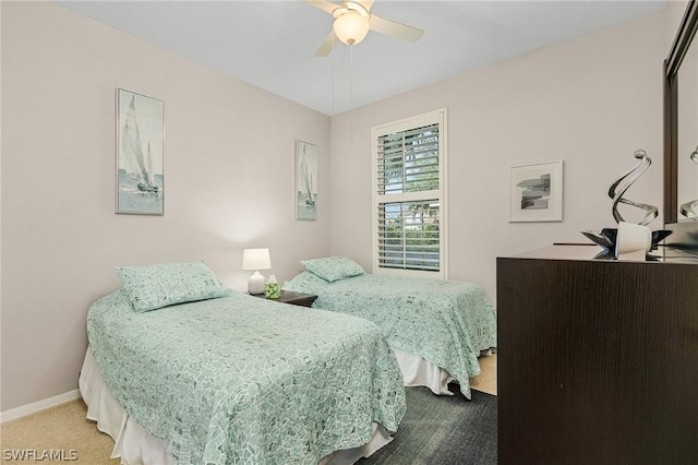 bedroom with ceiling fan and carpet flooring