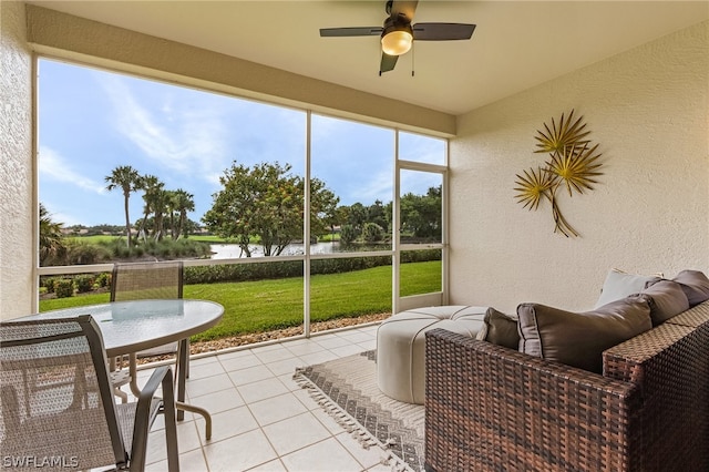 sunroom featuring ceiling fan