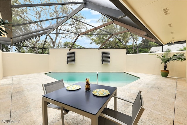 view of pool featuring a lanai and a patio area