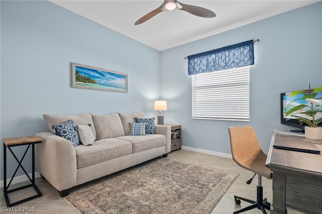 tiled home office featuring ceiling fan