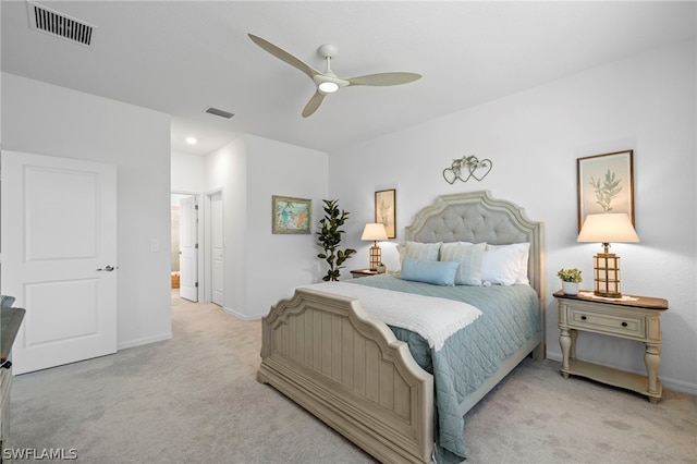 bedroom featuring light carpet and ceiling fan