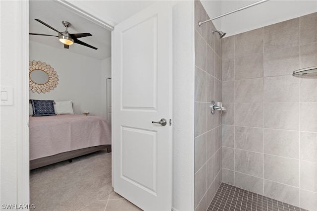 bathroom with tile patterned floors, ceiling fan, and a tile shower