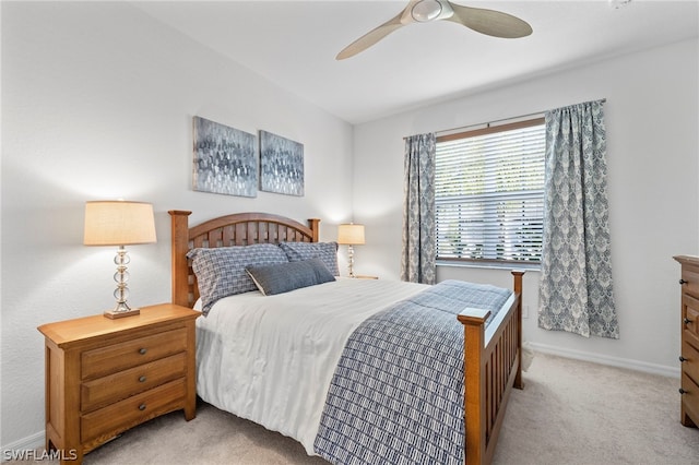 bedroom featuring ceiling fan and light colored carpet