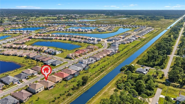 birds eye view of property with a water view