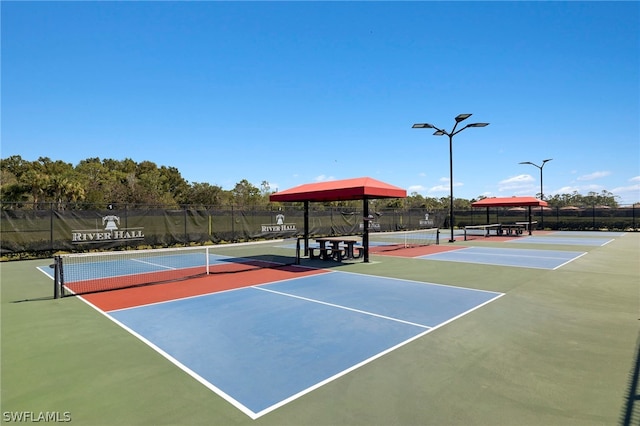 view of sport court featuring basketball hoop