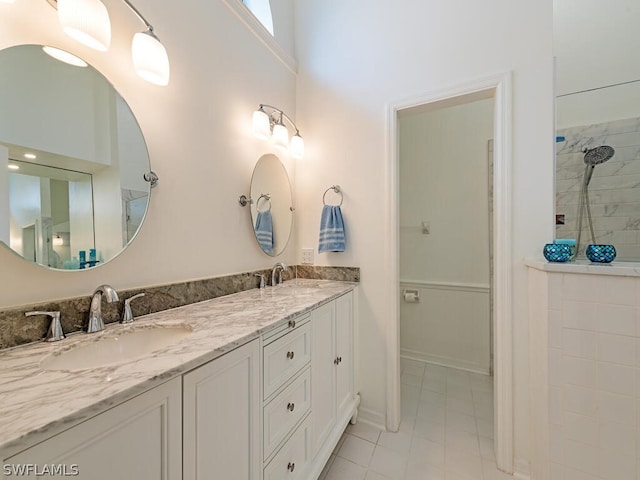 bathroom with vanity and tile patterned floors