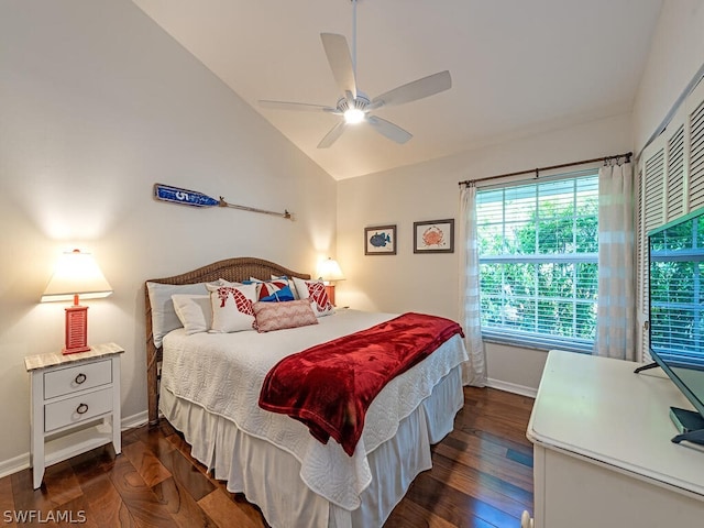 bedroom with dark hardwood / wood-style flooring, a closet, ceiling fan, and lofted ceiling