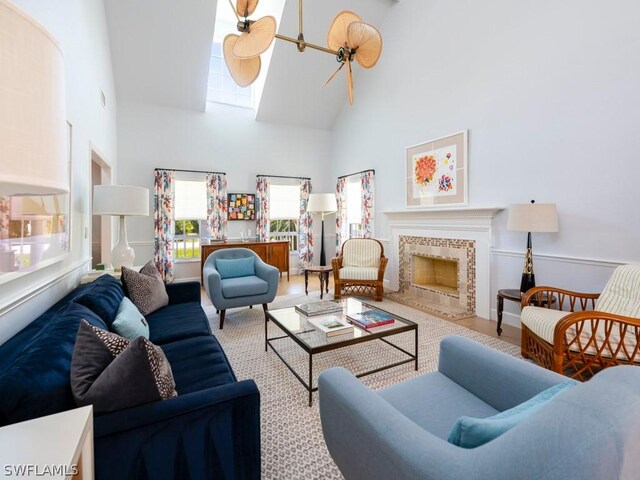 living room with hardwood / wood-style flooring and high vaulted ceiling